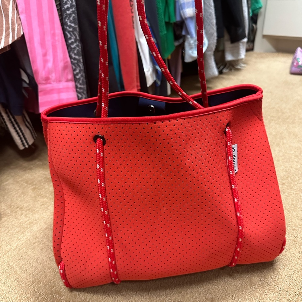 Ah-dorned neoprene bag